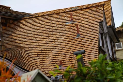 Natural cedar wood shake roofing material - warm amber tones