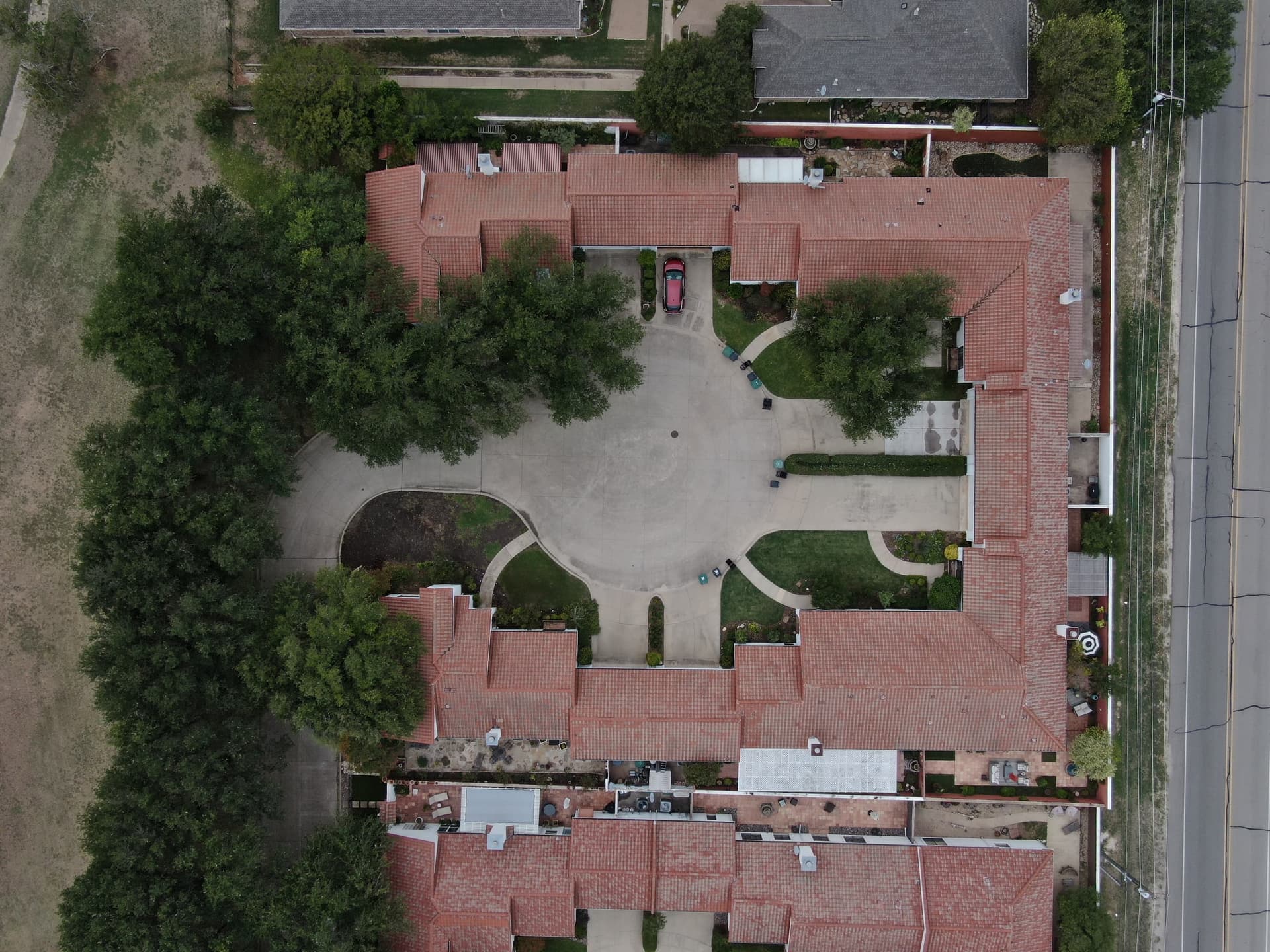 Aerial overhead view of Fort Worth multifamily apartment complex with tile roofs