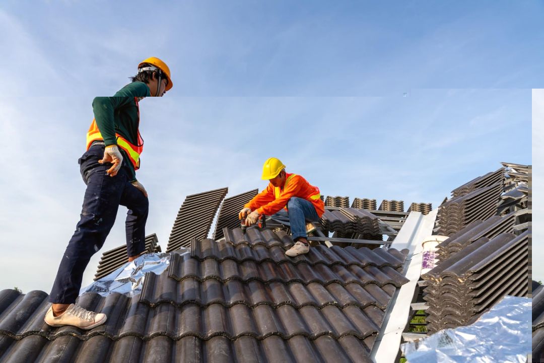 Roofing crew documenting and completing work on a residential roof